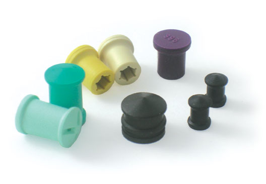 Eight medical device parts in plastic