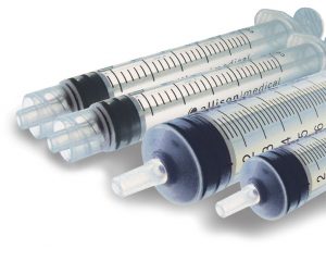 A grouping of four empty syringes without needles