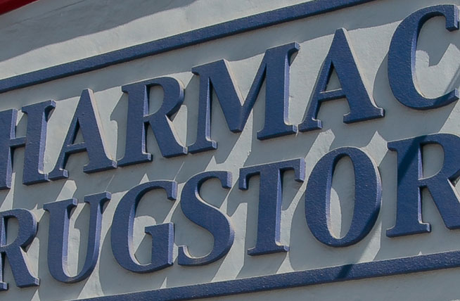 The building sign on the outside of a pharmacy and drugstore